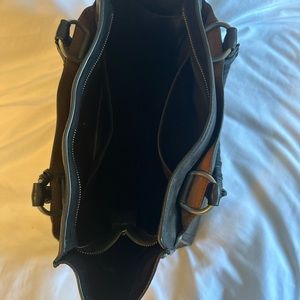 Barely used and kept in dust bag. Dual braided shoulder straps.